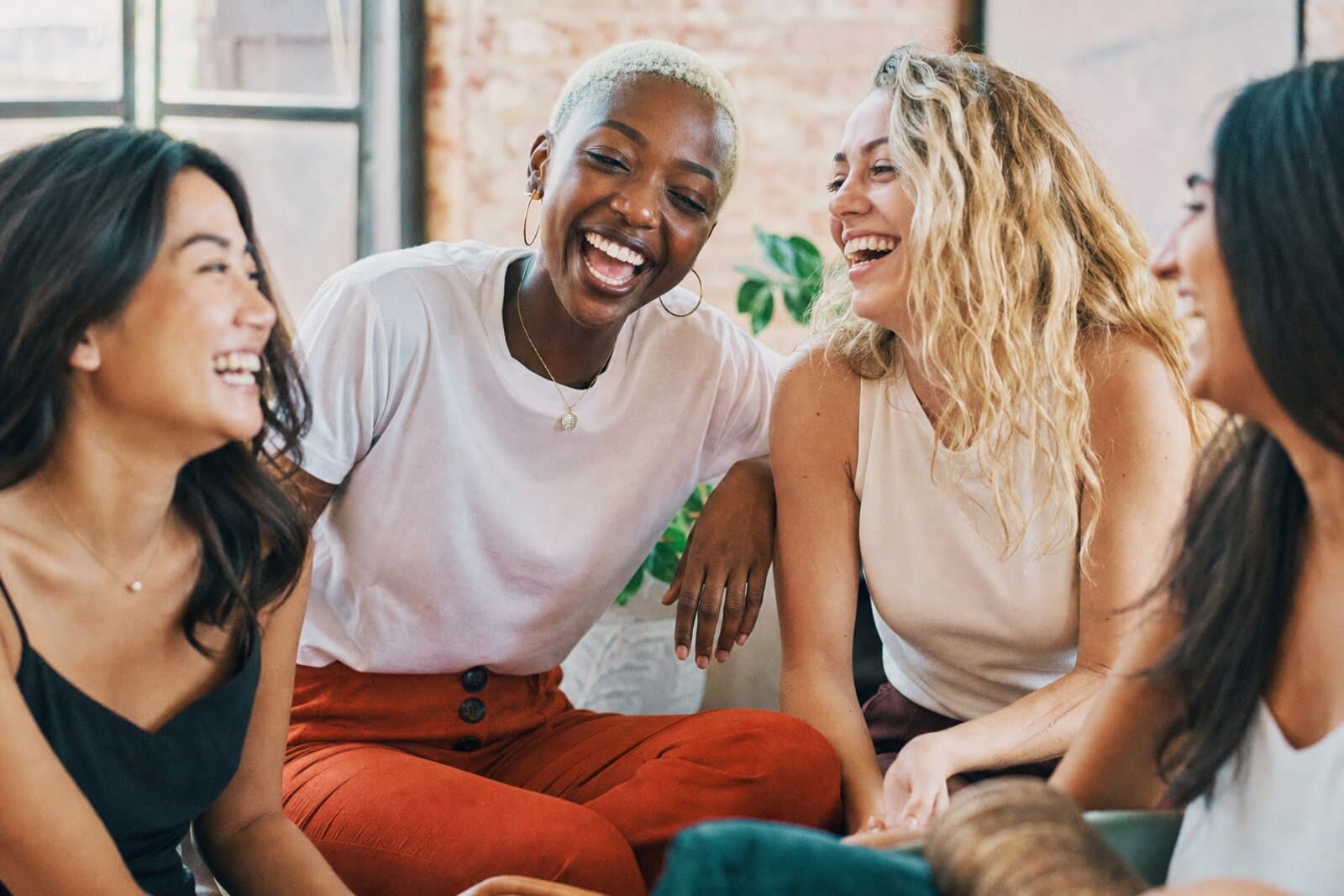 Young women laughing together